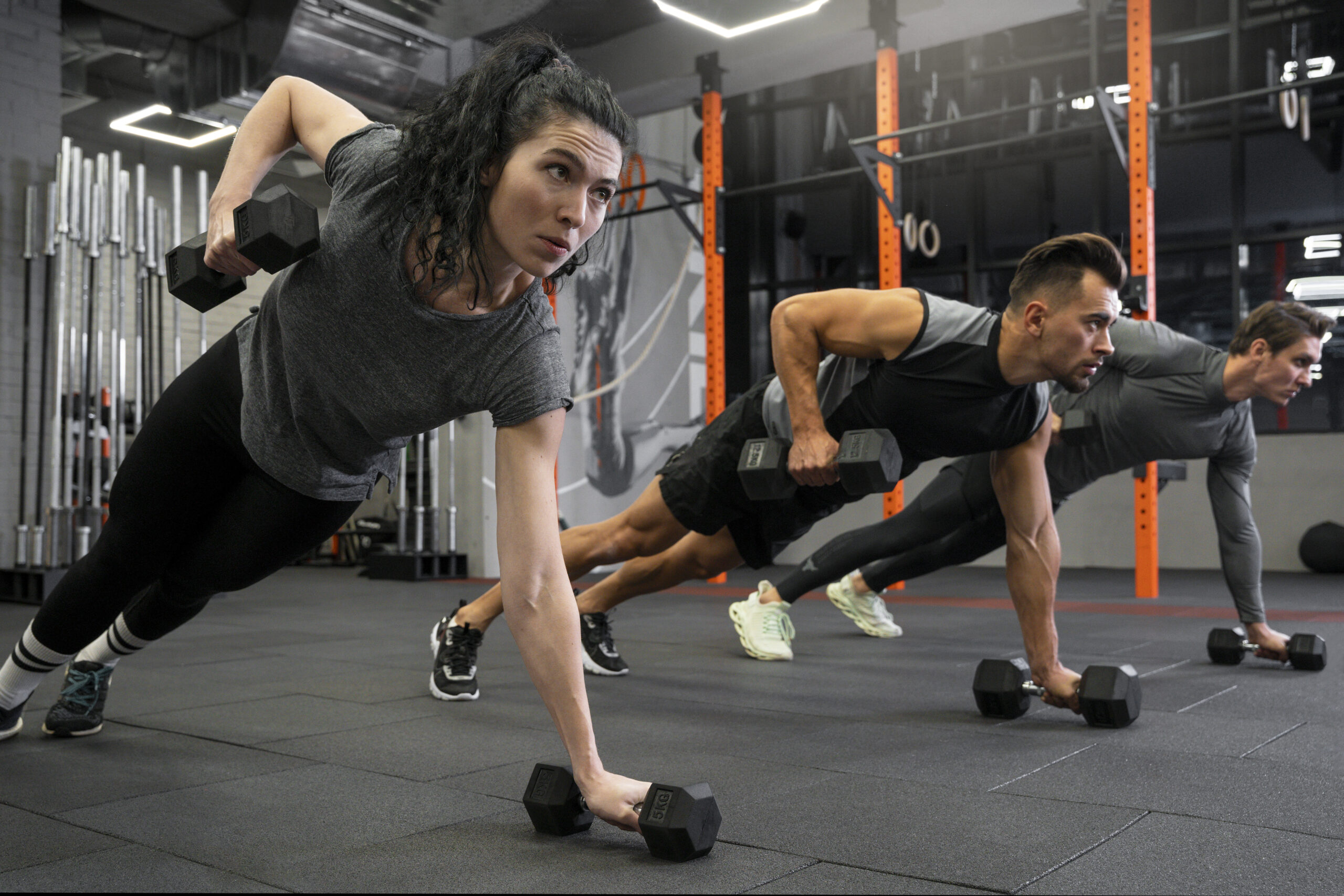 people-working-out-indoors-together-with-dumbbells